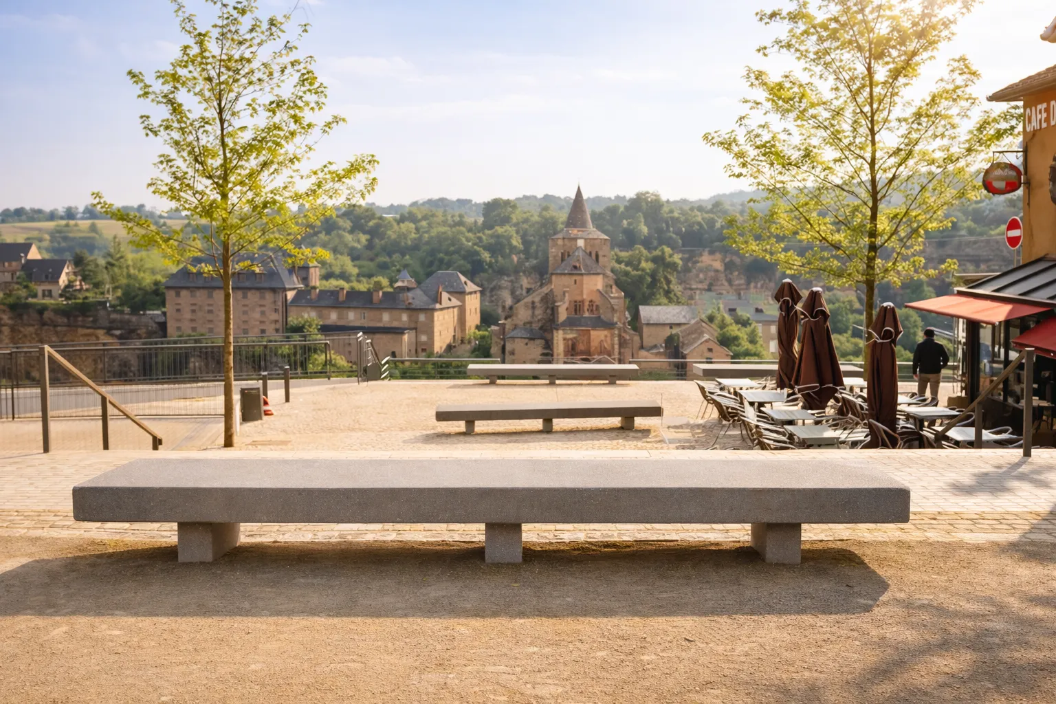 Long concrete bench with three legs